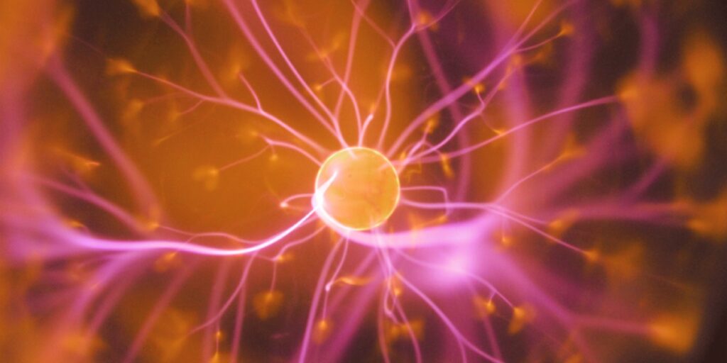 image of a firing neuron representing how trauma travels through the nervous system impacting the body and mind